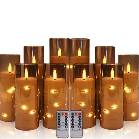 Set of LED candles with remote controls on a white background