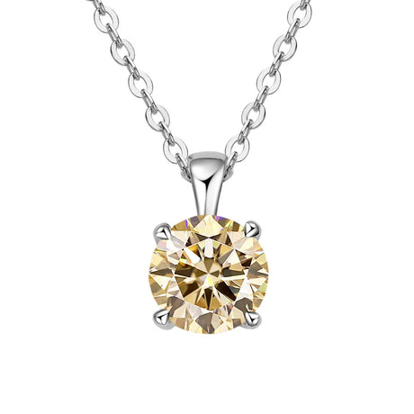 Gold diamond pendant on a silver chain against a white background