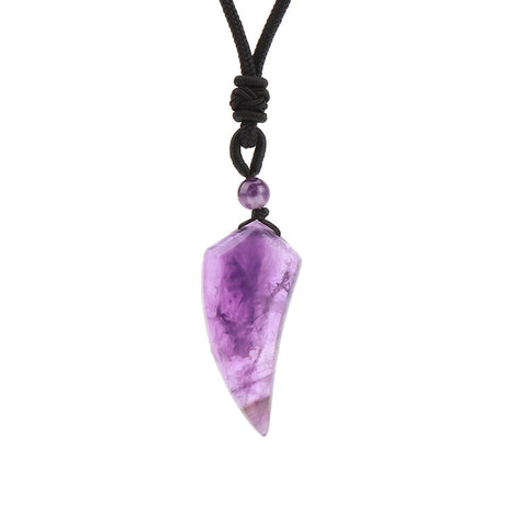 Purple crystal pendant on a black cord against a white background