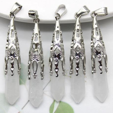 Five silver pendants on a white background