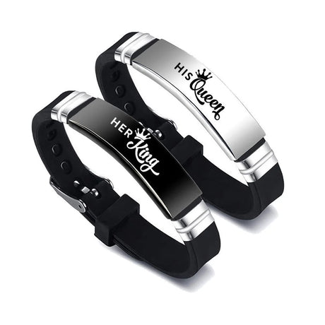 Pair of black and silver bracelets with 'His Queen' and 'Her King' text on a white background