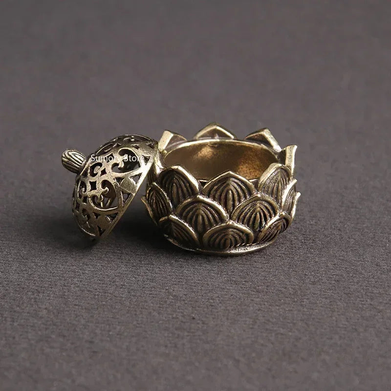 Bronze decorative item with intricate patterns on a gray background