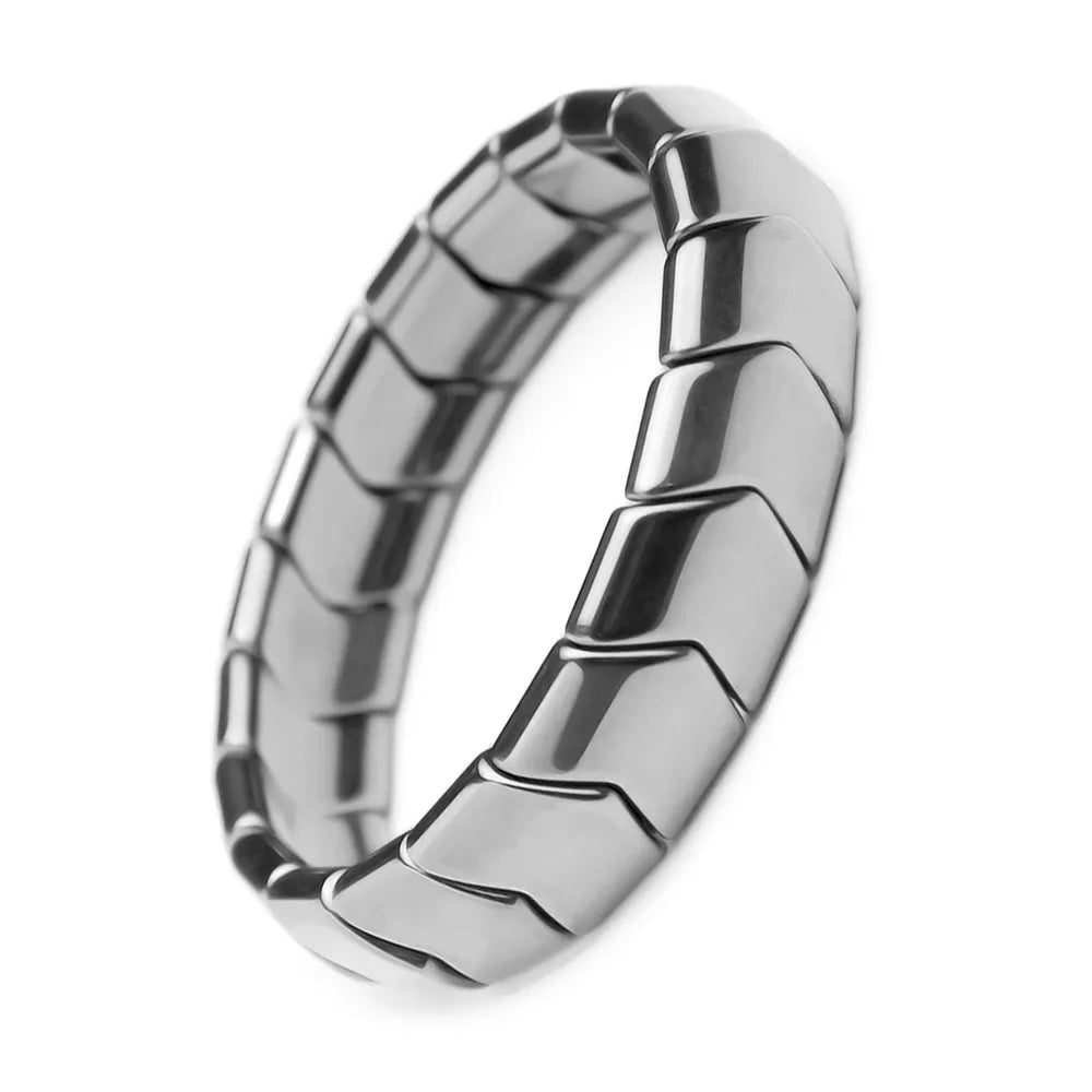 Silver ring with a textured design on a white background