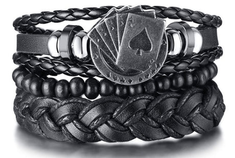 Black braided leather bracelet with metal emblem on a white background