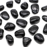 Black pebbles on a white background