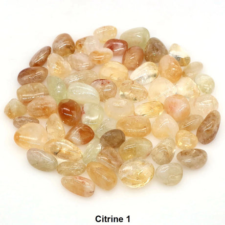 Heap of multicolored tumbled stones labeled 'Citrine 1' on a white background