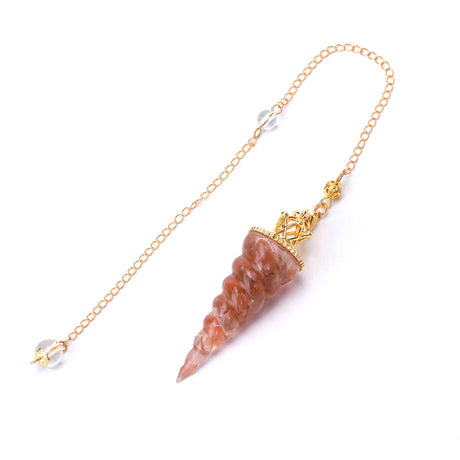 Decorative pendant with gold chain and stone on a white background