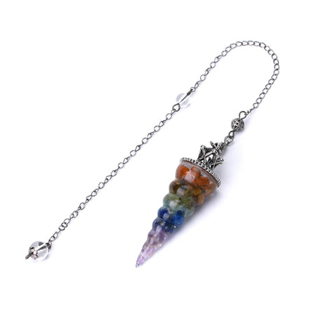Crystal pendulum with multicolored stones on a white background