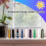 Colorful crystal sticks on a windowsill with a plant and text 'Replenish Energy Under The Sun'.
