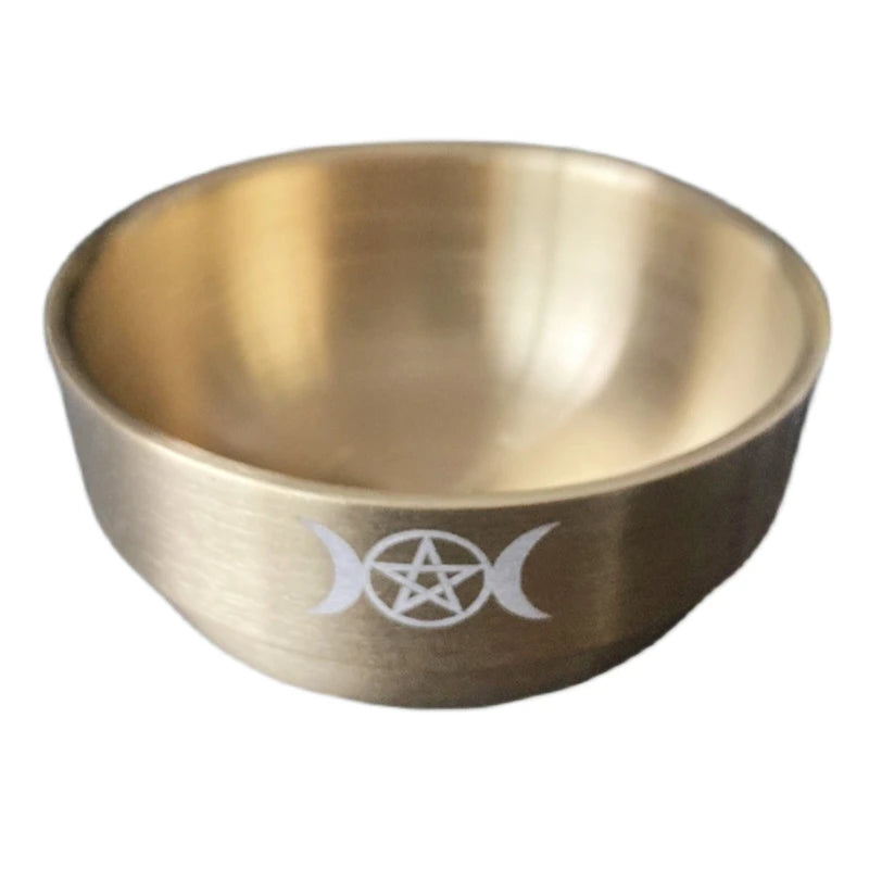 Brass bowl with a pentacle symbol on a white background