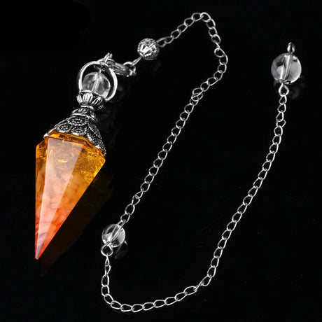 Crystal pendant with chain on a black background