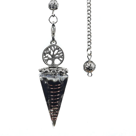 Crystal pendulum with tree of life design on a white background