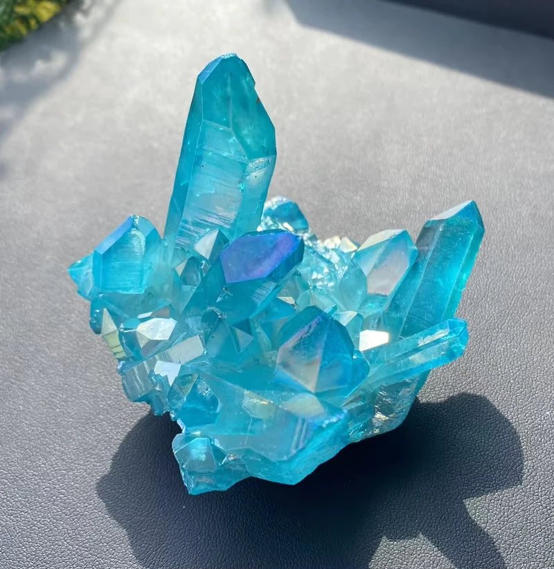 Blue crystal cluster on a gray surface