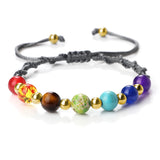 Colorful beaded bracelet with various beads on a white background