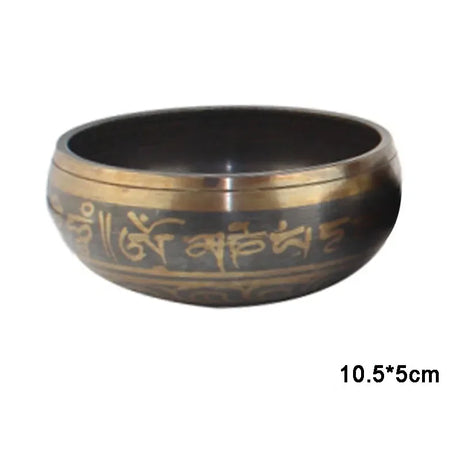 Bronze singing bowl with engraved text on a white background