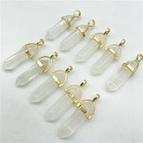 Clear crystal pendants with gold accents on a white background