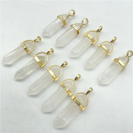 Clear crystal pendants with gold accents on a white background