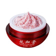 Red jar of dragon blood cream with white lid on a white background