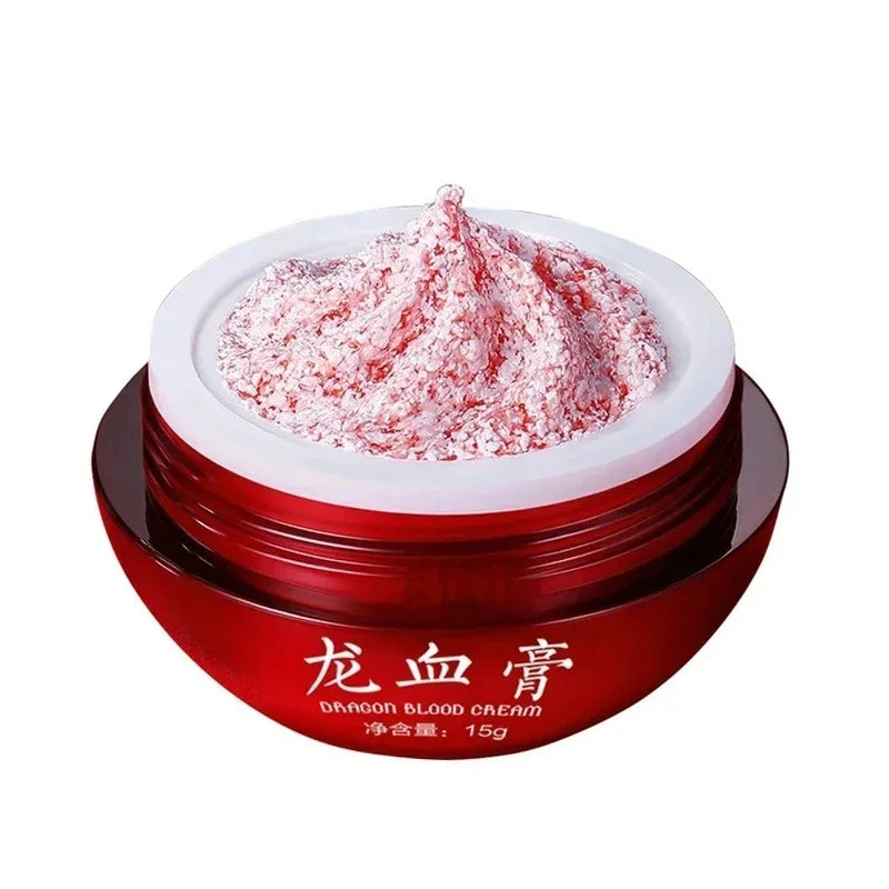 Red jar of dragon blood cream with white lid on a white background