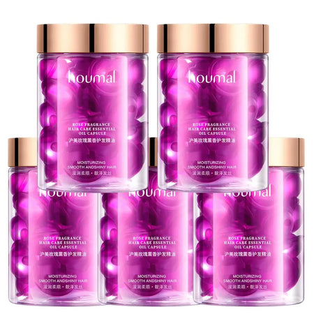 Set of four purple hair care bottles with gold caps on a white background