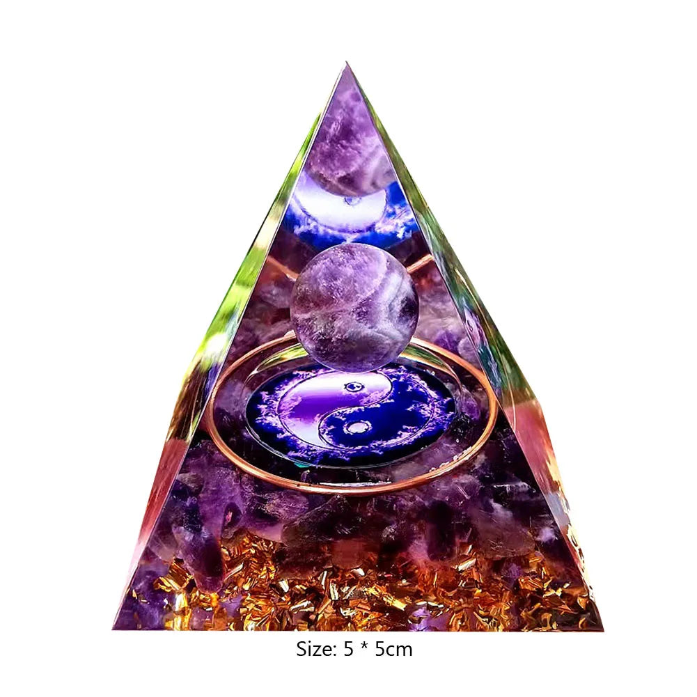 Triangular pyramid with crystal balls and yin yang symbol on a white background