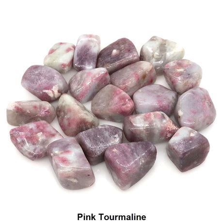 Pink tourmaline stones on a white background