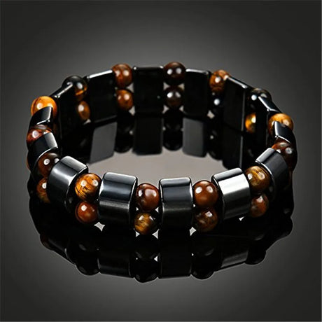 Bracelet with black and brown beads on a dark background