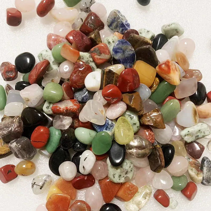 Assorted colorful gemstones on a white background