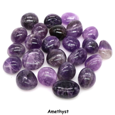 Collection of purple amethyst stones on a white background