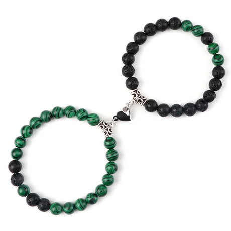 Two beaded bracelets, one green and one black, on a white background.