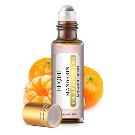 Roller bottle of Euquee Mandarin Roller Perfume Oil with mandarin oranges on a white background