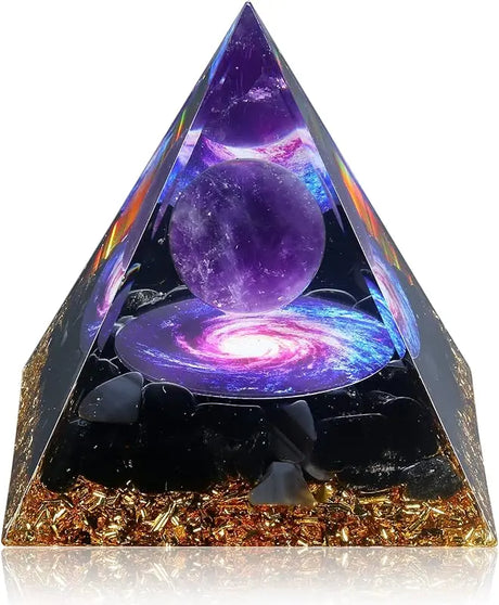 Pyramid-shaped object with a purple sphere and galaxy design on a white background