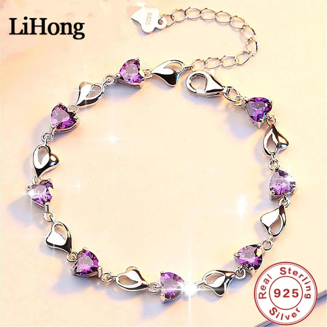 Silver bracelet with purple heart-shaped stones on a beige background, featuring the LiHong brand.