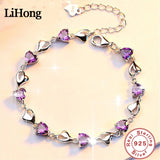 Silver bracelet with purple heart-shaped stones on a beige background, featuring the LiHong brand.