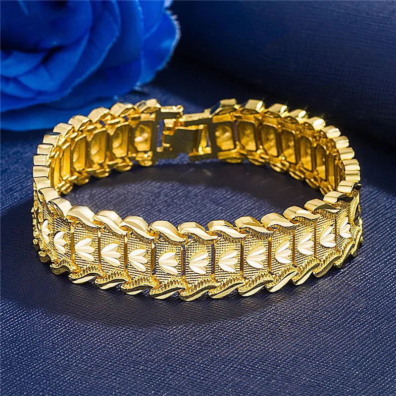 Gold bracelet on a dark blue fabric background