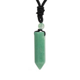 Green crystal pendant necklace on a white background