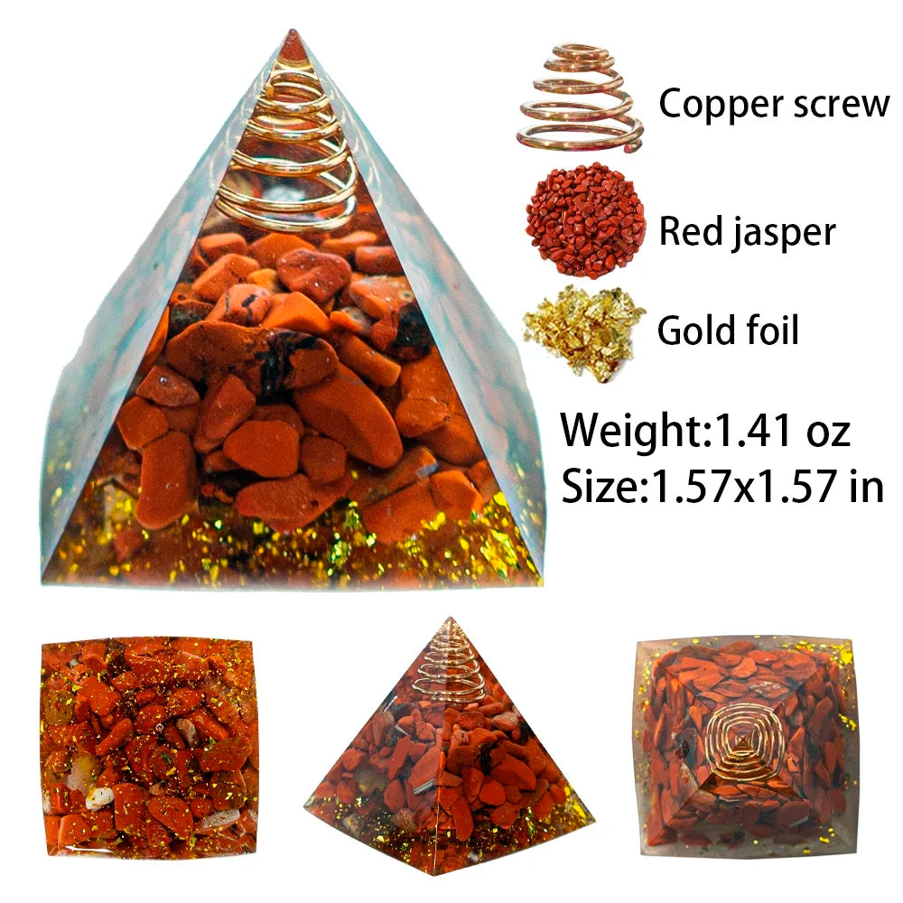 Pyramid-shaped crystal with copper screw, red jasper, and gold foil on a white background