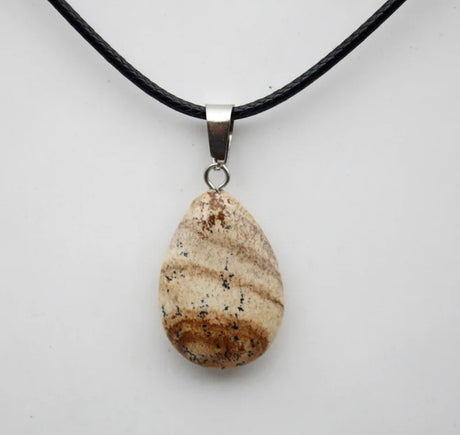 Necklace with a stone pendant on a white background