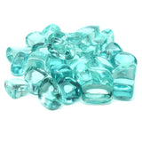 Turquoise glass pebbles on a white background