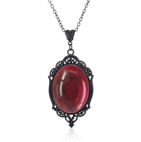 Necklace with a red gemstone and black metal frame on a white background