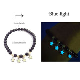 Black beaded bracelet with star charms, labeled 'Blue light' on a white background.