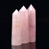 Three pink crystal towers on a black background