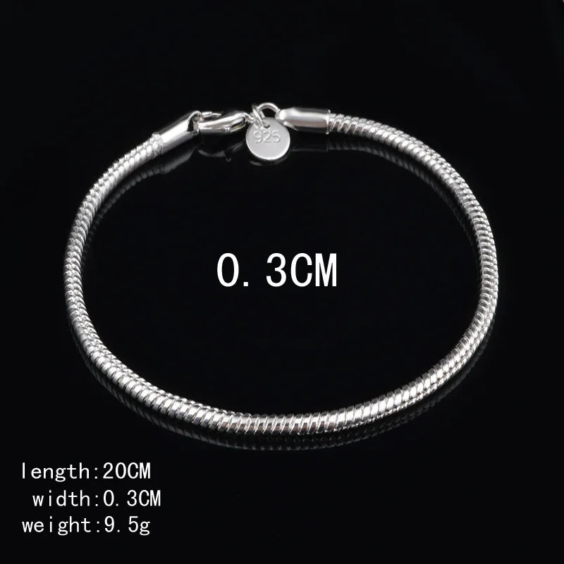 Silver bracelet with measurement details on a black background
