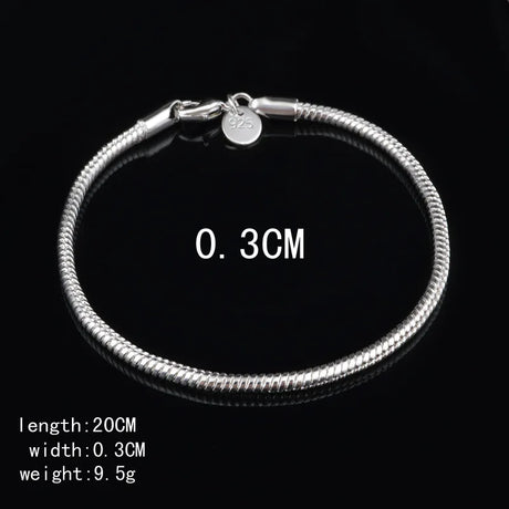 Silver bracelet with measurement details on a black background
