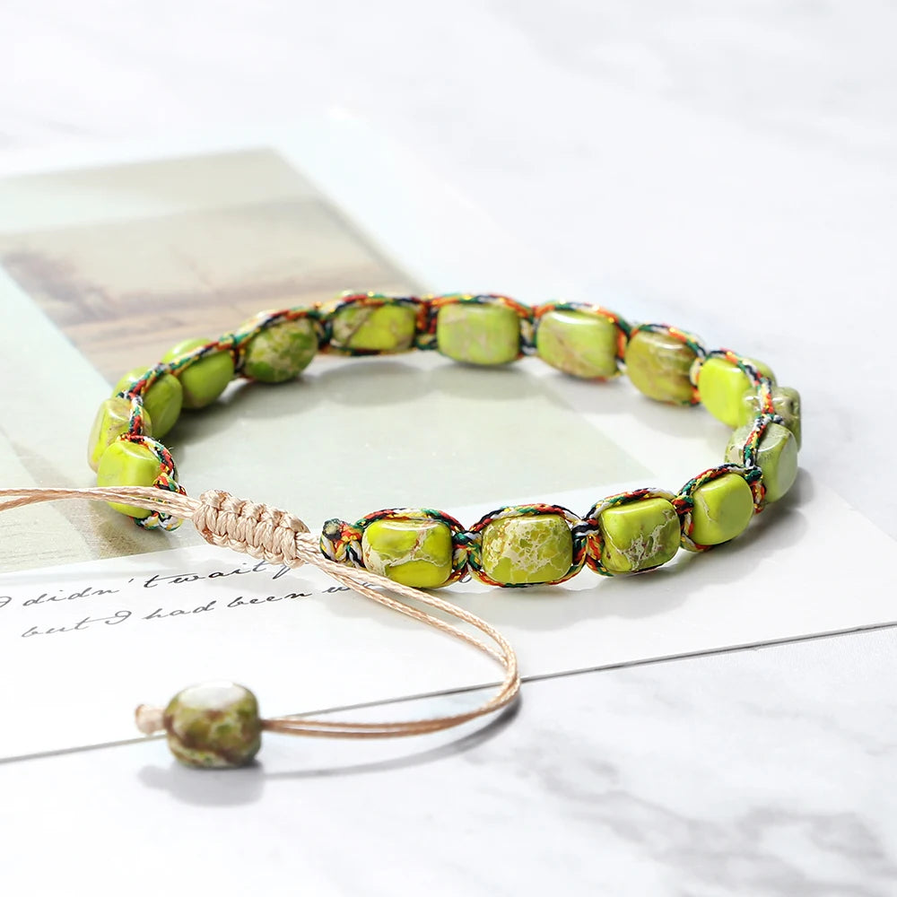 Necklace with green beads on a white surface
