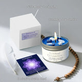 Scented soy candle with packaging, guide card, and beads on a light gray background