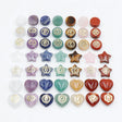 Collection of various chakra stones on a white background