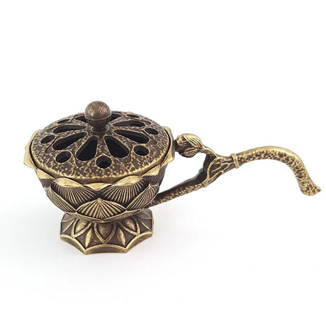 Bronze incense burner with decorative design on a white background