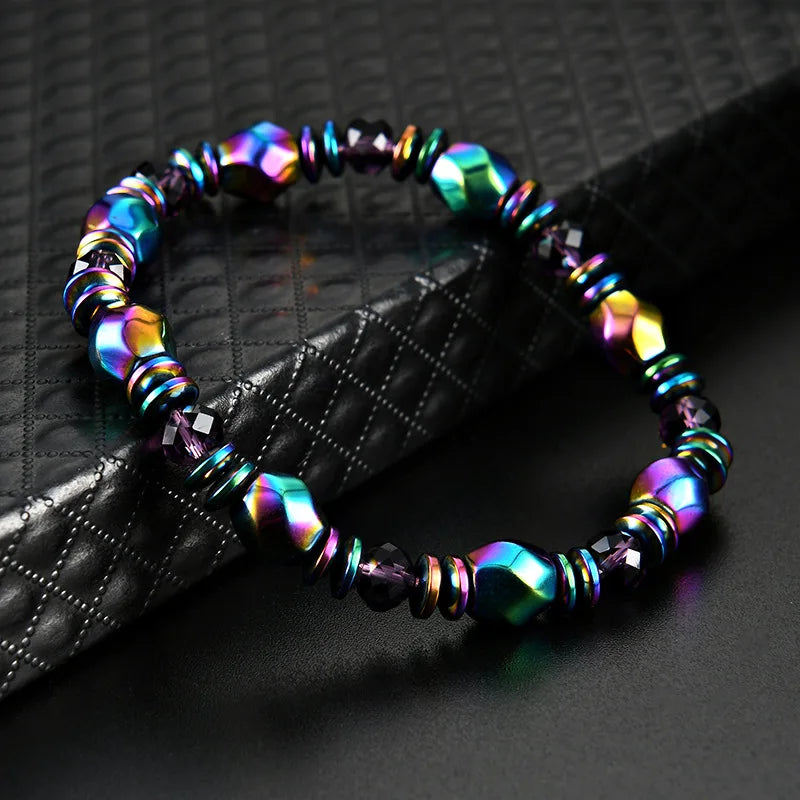 Multicolored beaded bracelet on a textured black surface