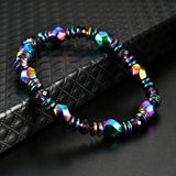 Multicolored beaded bracelet on a textured black surface